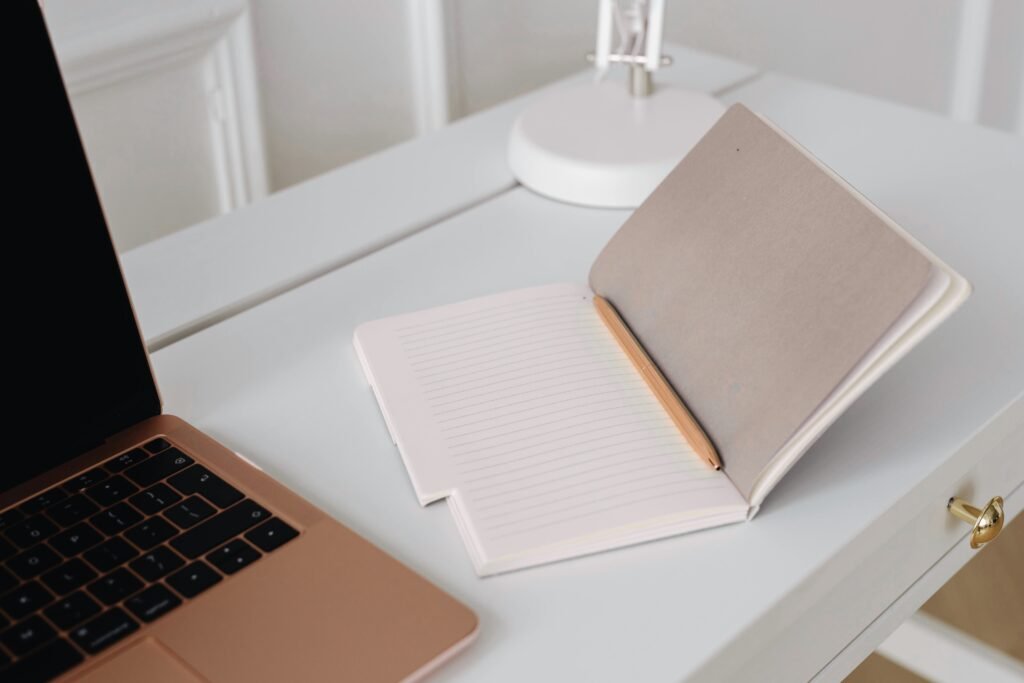 About Us Middle Pic Notebook And Pen 1024x683